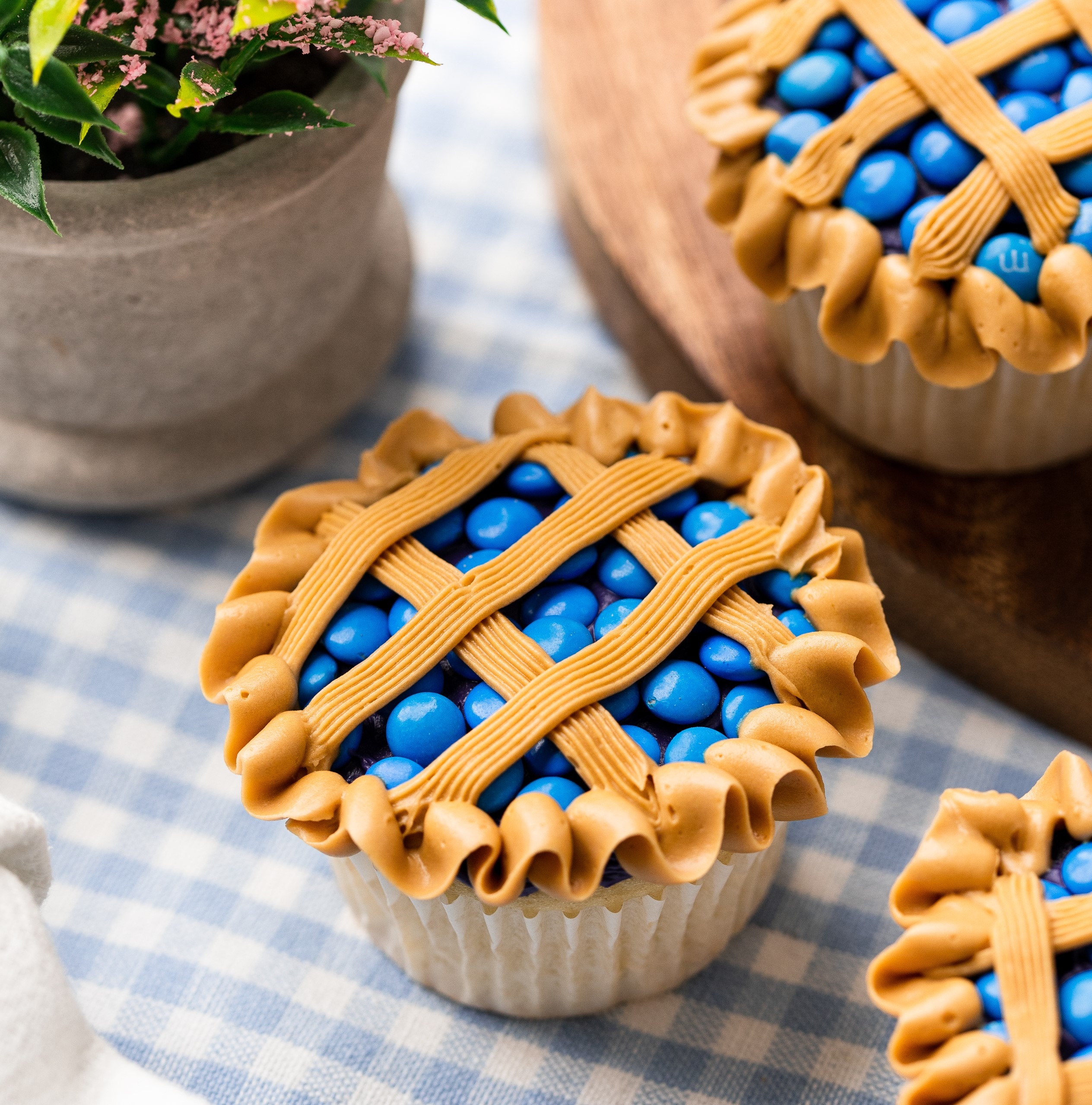 blueberry pie cupcakes on a checkered tablecloth